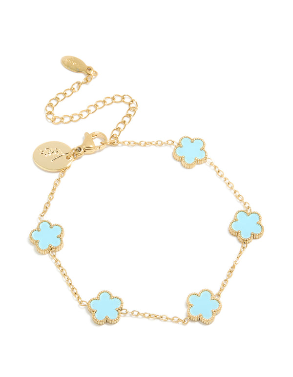 Showcasing a waterproof gold plated stainless steel light blue petal flower charm bracelet in powder blue and gold front view