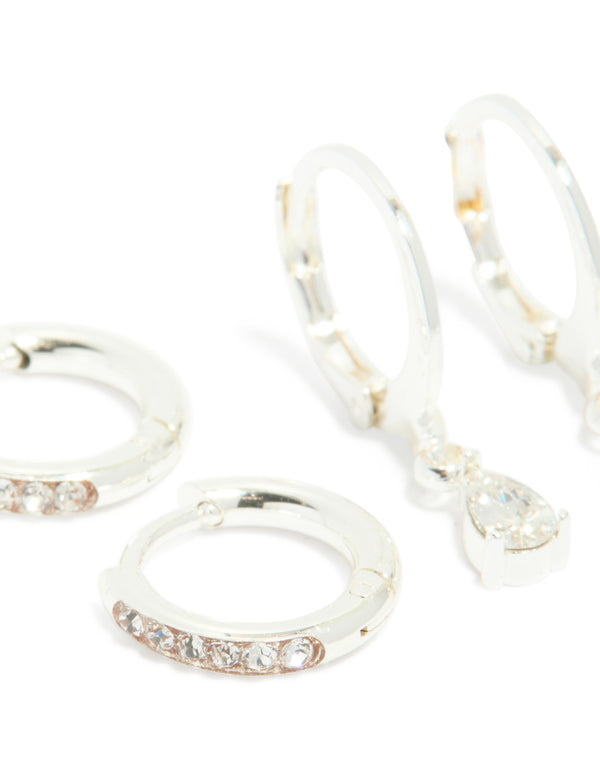 Crafted from waterproof stainless steel cubic zirconia simple stud and huggie earrings in a 3-pack and silver finish close up view