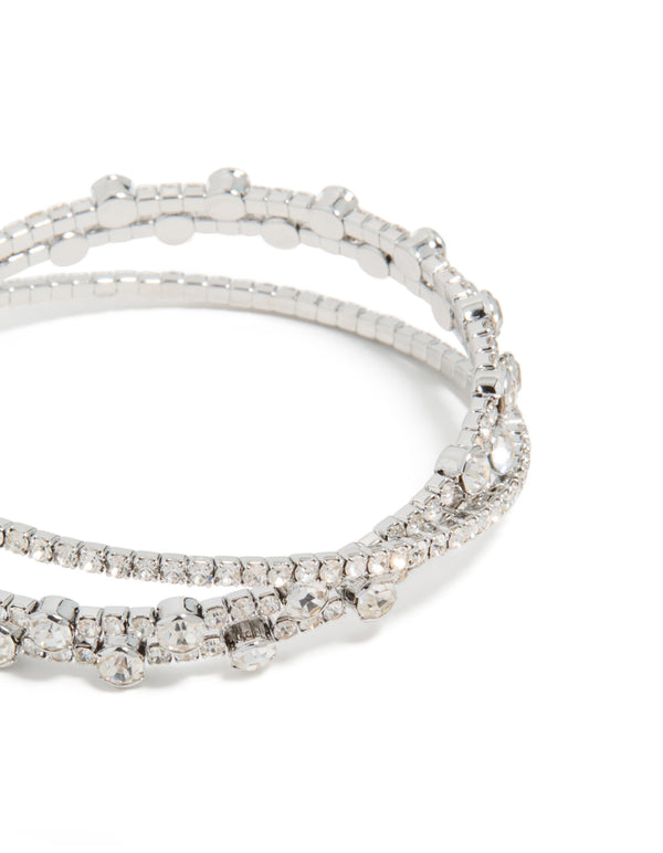 Highlighting silver diamante crossed circle wrist cuff,statement bangle in close up view