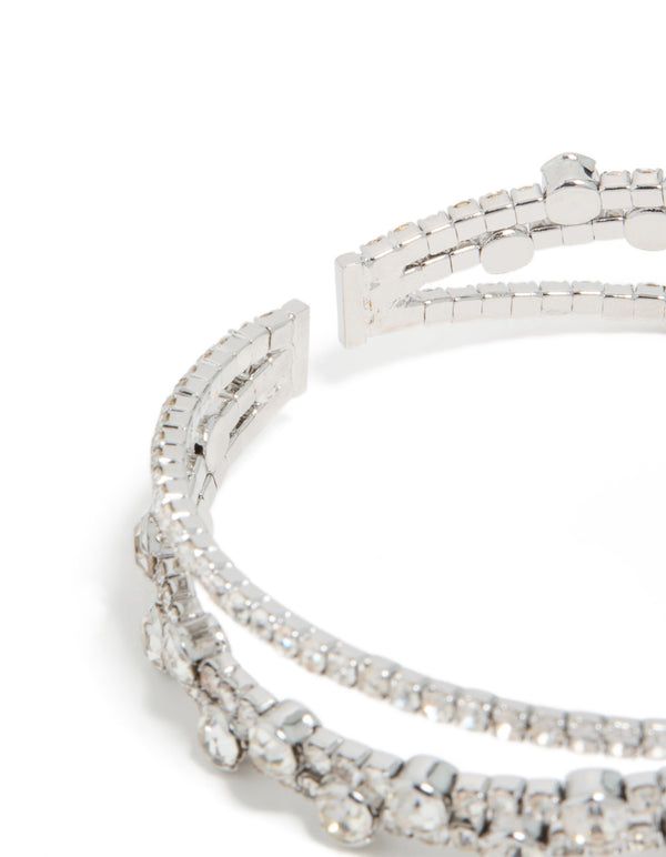 Detailed view of silver diamante crossed circle wrist cuff, statement bangle in closure detail view