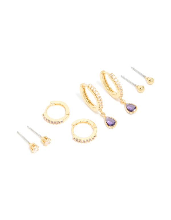 Discover gold plated brass amethyst cubic zirconia February birthstone earrings in a 4-pack with ball stud, hoop, and huggie closures featuring crystal accents front view