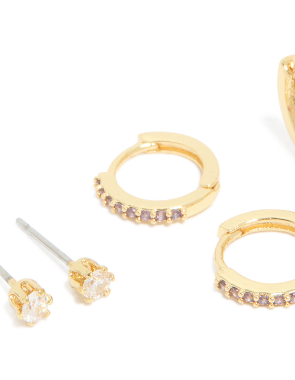 Beautifully crafted gold plated brass amethyst cubic zirconia February birthstone earrings in a 4-pack with ball stud, hoop, and huggie closures featuring crystal accents close up view