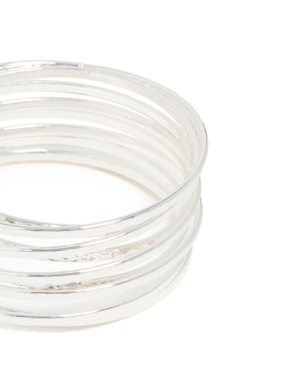 Featuring silver bangles pack with hammered and smooth textures in a close up view