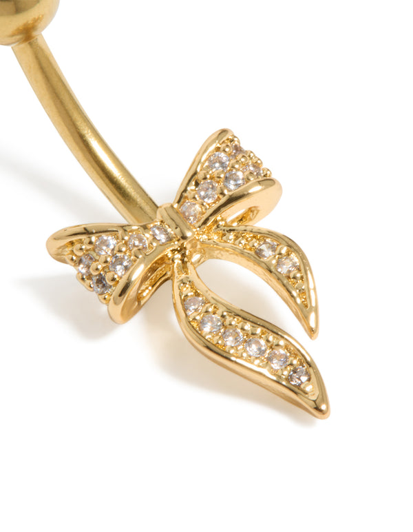 Showcasing a gold plated surgical steel belly bar with cubic zirconia pavé bow and ball ends detail close up view