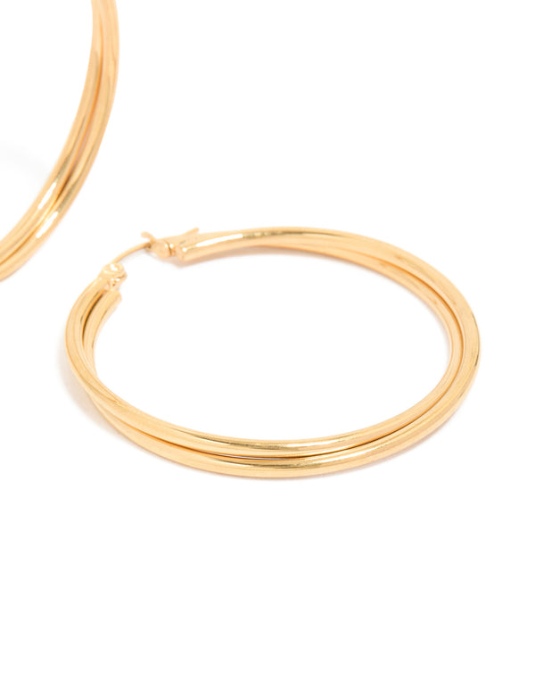 Crafted from surgical steel, these gold plated crossover hoop earrings in 40 MM post detail view