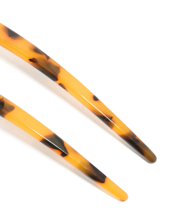 Crafted from tortoiseshell acrylic, this large basic hair pin features animal-leopard print in goldenrod, chocolate, and black detail view