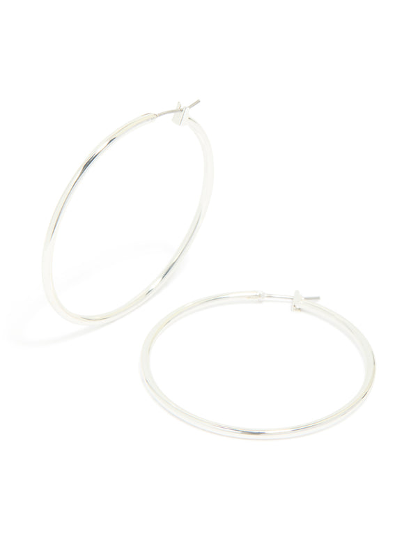 Elegant large thin hoop earrings in silver plated material with hoop closure front view
