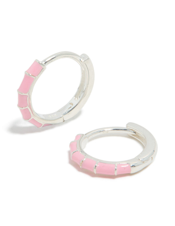 Beautifully crafted sterling silver pink enamel bamboo huggie earrings featuring hoop closure front view