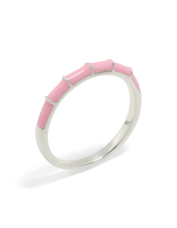 Sterling silver ring featuring pink enamel side detail view