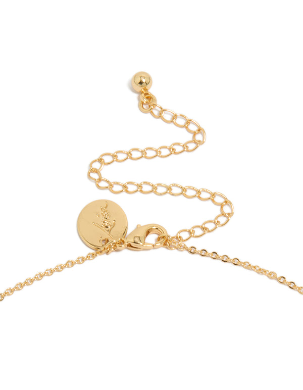 Highlighting the gold plated brass double cubic zirconia cross necklace with charm and statement design clasp detail view