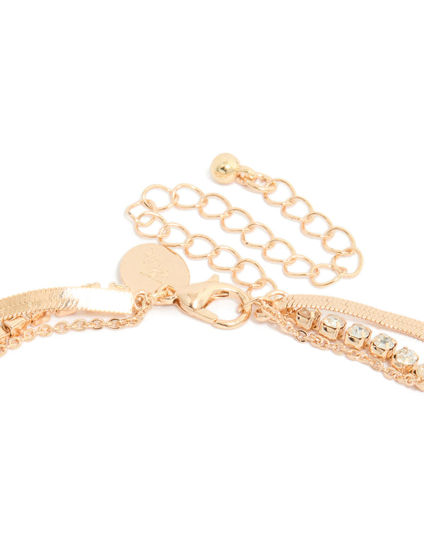Explore this gold diamante and snake chain layered necklace with pendant clasp detail view