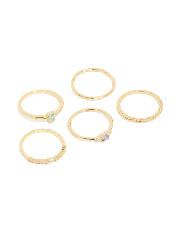 Showcasing gold plated aqua cubic zirconia rings 5-pack in stackable crystal charm design front view