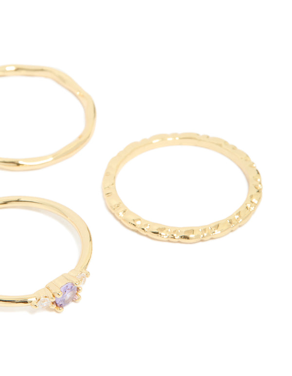 Crafted from gold plated material, aqua cubic zirconia rings 5-pack featuring stackable crystal charm design side detail view