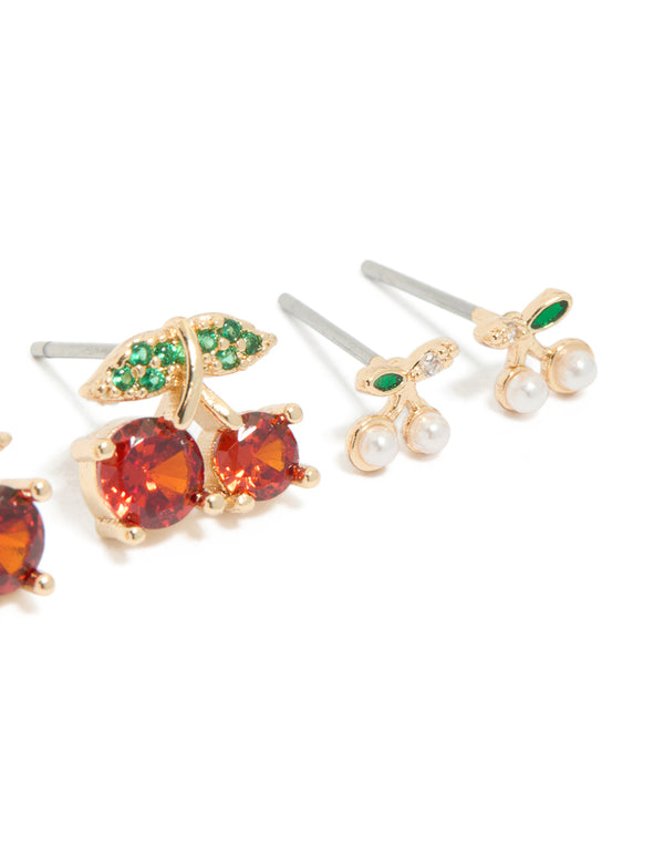 Designed with gold strawberry and cherries earrings 3-pack featuring fruit, leaf, pearl elements with stud closure in red, green, and white post detail view