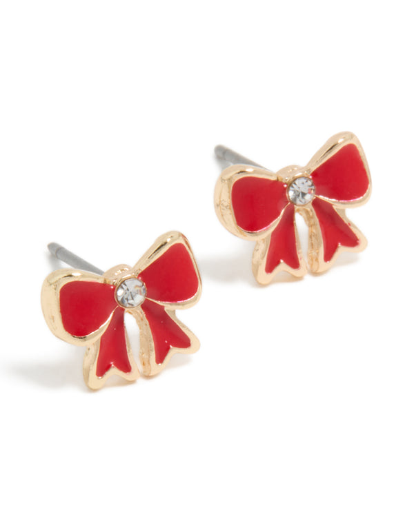 Charming dainty stud earrings featuring mini red bow with diamante center in gold front view