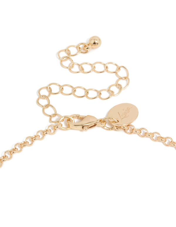 Highlighting a gold beaded tassel statement necklace with multicoloured accents in clasp detail view