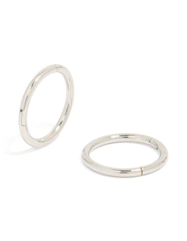 Showcasing surgical steel 8 mm thick sleeper hoop earrings in silver with chunky styling front view