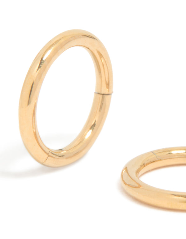 Featuring gold plated surgical steel 6mm thick sleeper earrings with chunky dainty hoop closure close up view