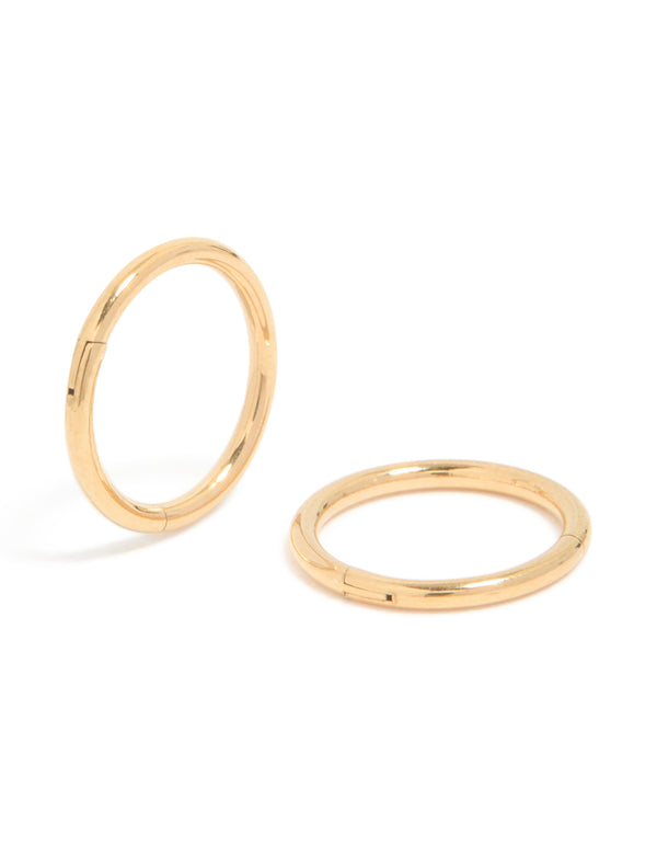Showcasing gold plated surgical steel 8 MM thick sleeper earrings with hoop closure front view