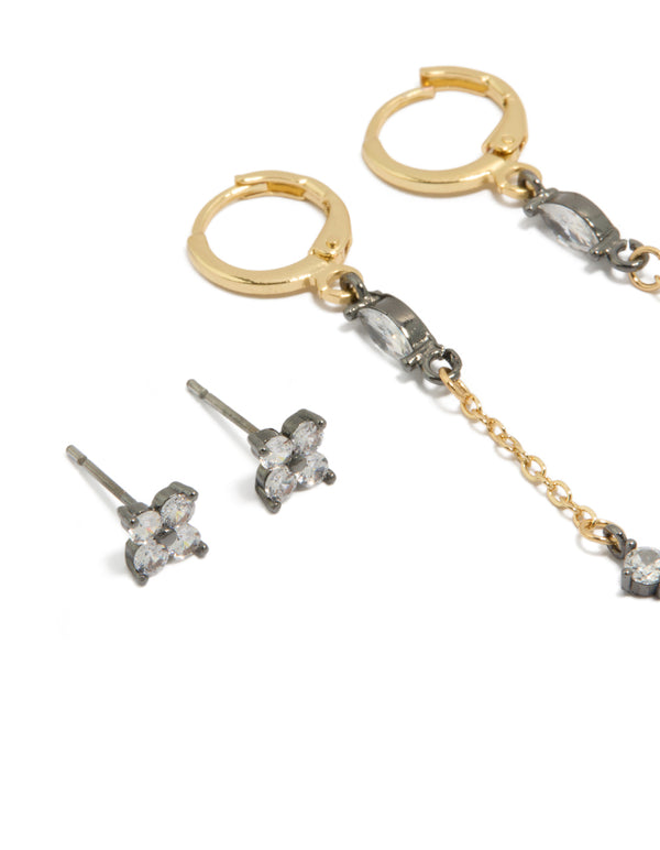 Crafted from plated materials with gold, silver and clear accents, these flower chain and huggie earrings are in a 3-pack set close up view