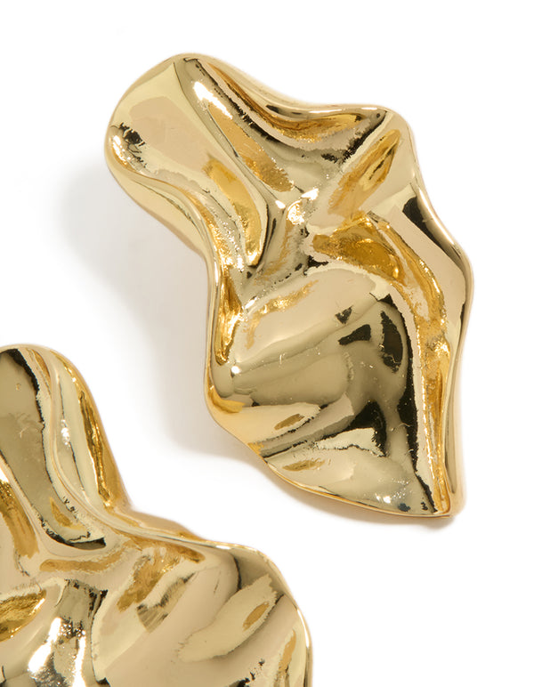 Showcasing gold plated wavy organic drop stud earrings with sculptural texture close up view