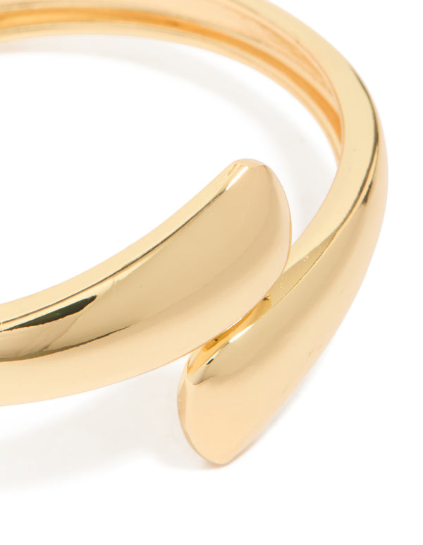 Showcasing gold plated flat teardrop hinged bangle close up view
