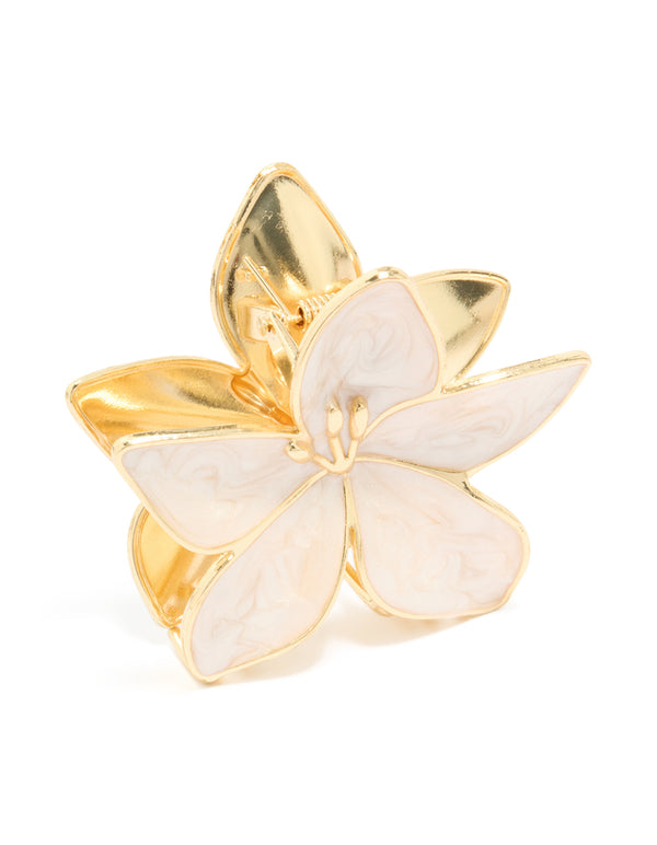 Showcasing a floral enamel tropical stem hair claw clip in gold and cream side view