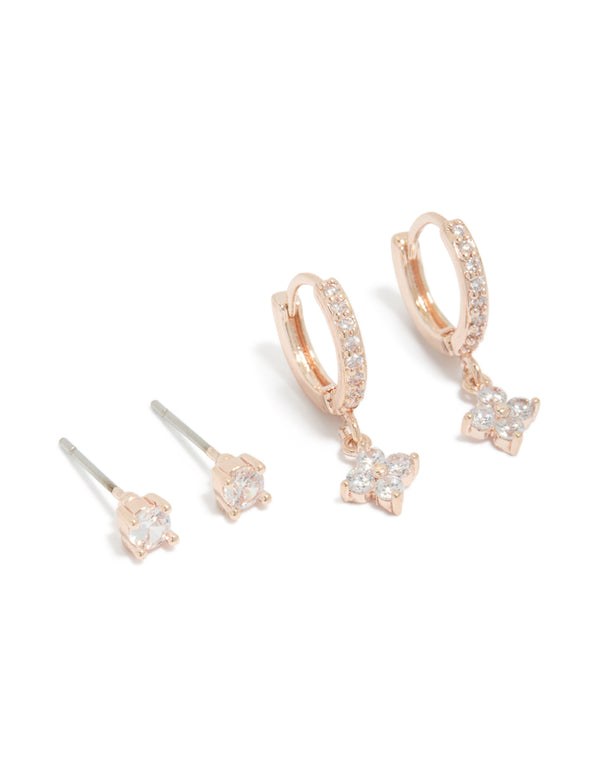 Showcasing dainty rose gold plated cubic zirconia studs and flower huggie earrings 2-pack featuring floral and crystal accents front view