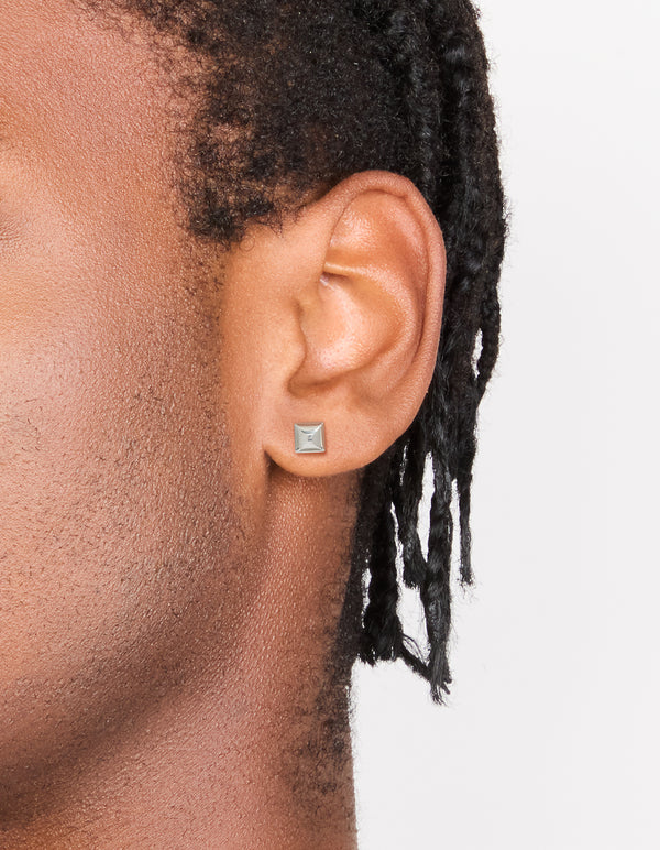 Featuring mens waterproof stainless steel studded earrings in silver with closure on ear view