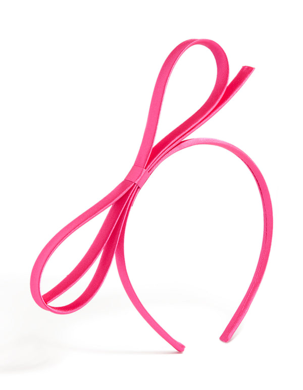 Showcasing a hot pink thin bow headband with solid design front view