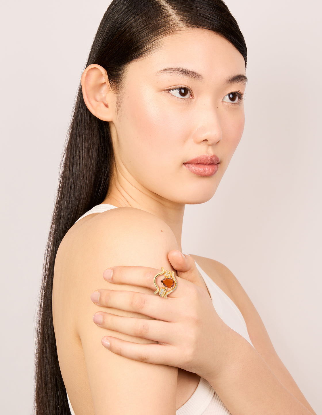 Featuring gold plated red cubic zirconia teardrop and wavy rings 3-pack with crystal statement design on finger view