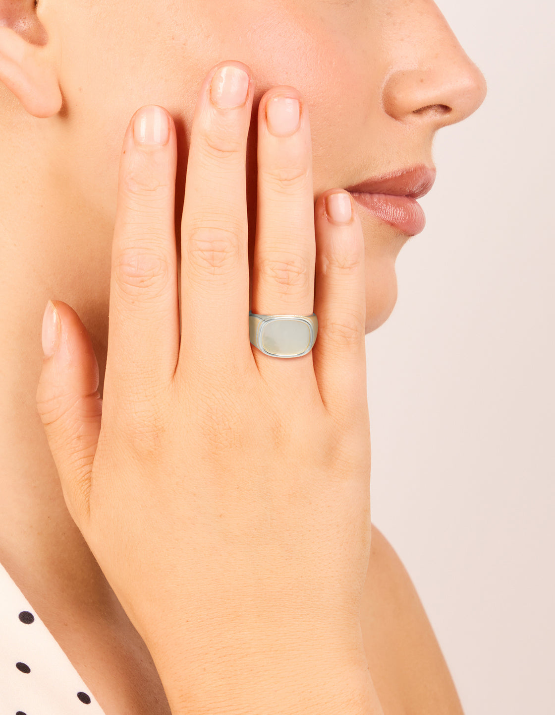 Featuring a waterproof stainless steel square shell signet ring in silver with clear tones, designed as a statement piece on finger view