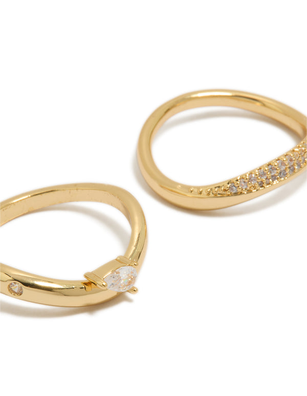 Featuring gold plated metal with pear cut cubic zirconia stones, these crystal statement stacking rings come in a dainty 2-pack design close up view