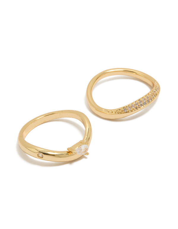 Crafted from gold plated metal with pear cut cubic zirconia stones, these crystal statement stacking rings come in a dainty 2-pack design front view