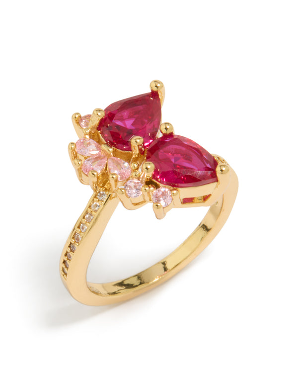 Featuring a gold plated statement ring with double pear cut red and light pink cubic zirconia front view