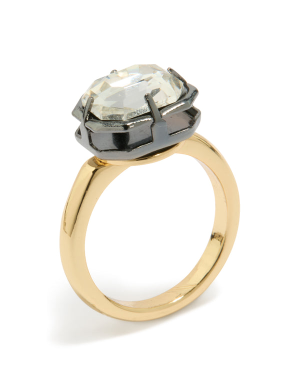 Showcasing a gold plated cubic zirconia mixed metal statement ring with crystal in silver and chunky styling front view