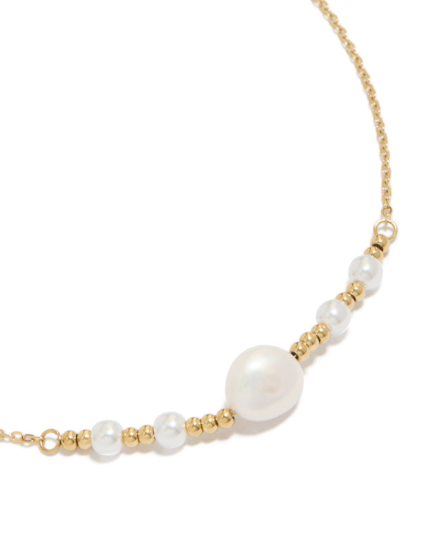 Beautifully crafted waterproof gold plated stainless steel pearls chain necklace featuring balls in a statement style close up view