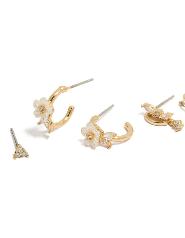 Featuring gold plated cubic zirconia flower and half butterfly earrings in dainty huggie style with crystal close up view