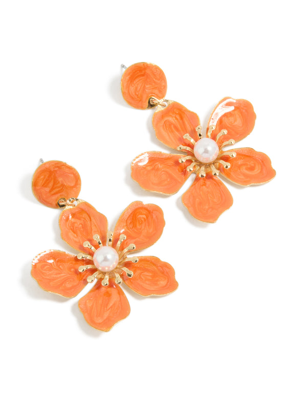 Showcasing statement drop earrings featuring big orange floral design with pearl center accents in gold front view
