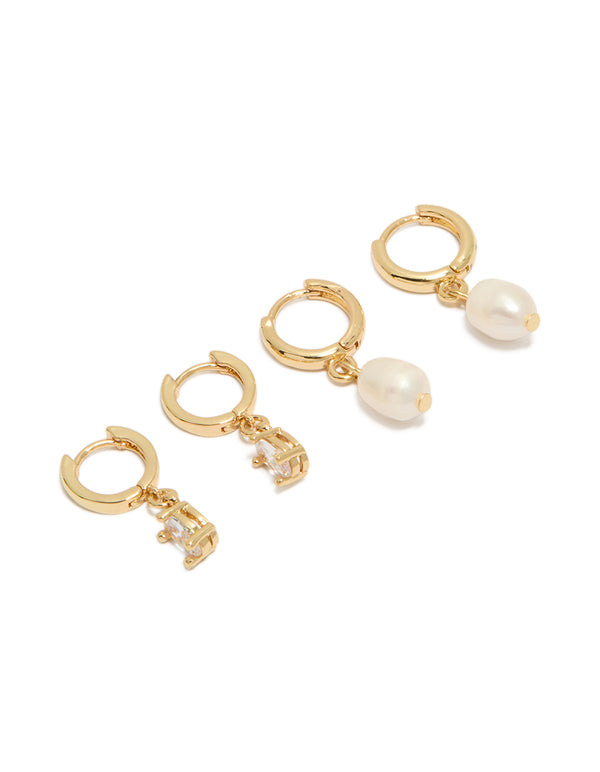 Showcasing pearl huggie hoop 2-pack earrings crafted from gold plated cubic zirconia and crystal in ivory front view