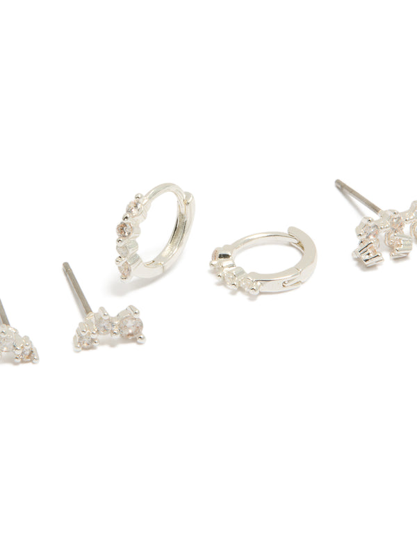 Featuring dainty mini trio stud and huggie earrings in silver plated cubic zirconia 3-pack close up view