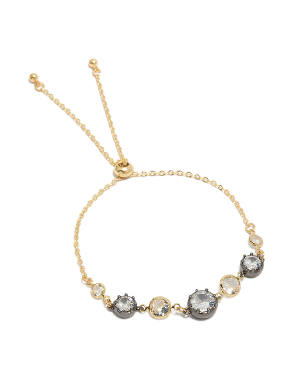 Featuring a mixed metal plated toggle bracelet with cubic zirconia and crystal accents in gold, silver, and clear front view