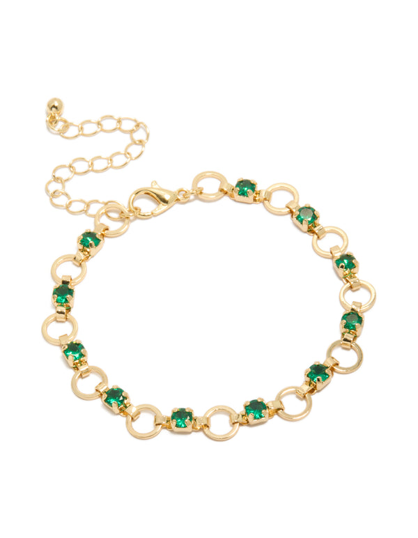 This elegant gold plated link bracelet features alternating round green cubic zirconia stones front view