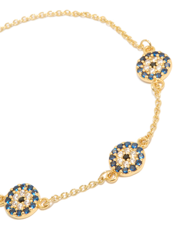 Stunning evil eye bracelet featuring gold plated metal with navy and clear details close up view