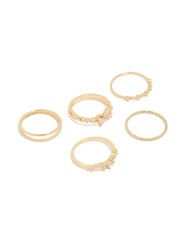 Showcasing a gold pink and clear cubic zirconia flower rings 5-pack with butterfly charm and floral crystal details front view