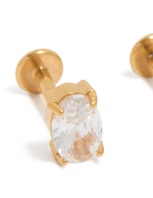 Featuring gold plated surgical steel cubic zirconia oval flat back studs in gold and clear close up view
