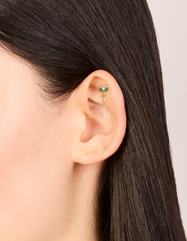 Featuring gold plated surgical steel pink cubic zirconia rose drop single flat back stud with floral design and Marquise stone cut in dainty styling on ear view