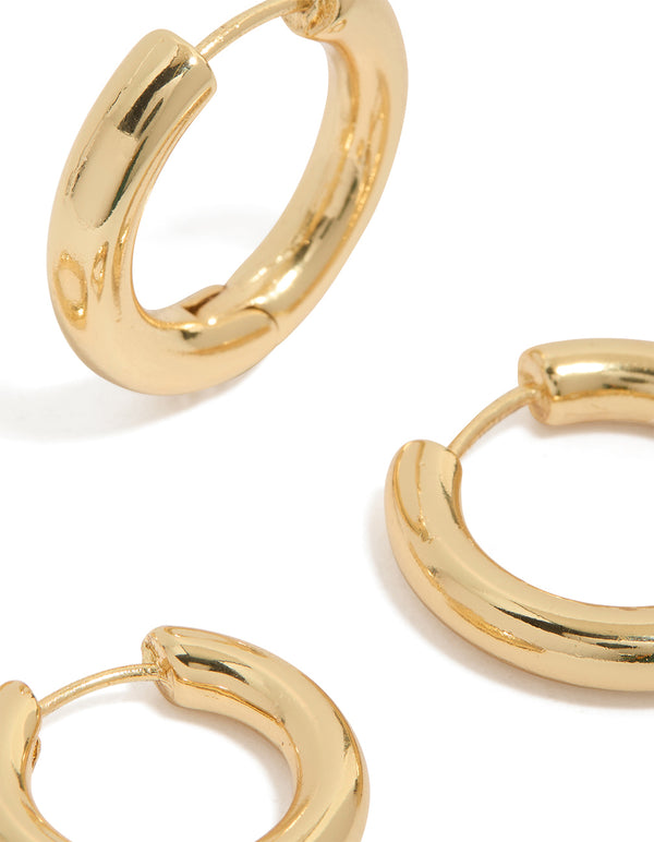 Showcasing gold plated plain thin huggie earrings in a 2-pack close up view