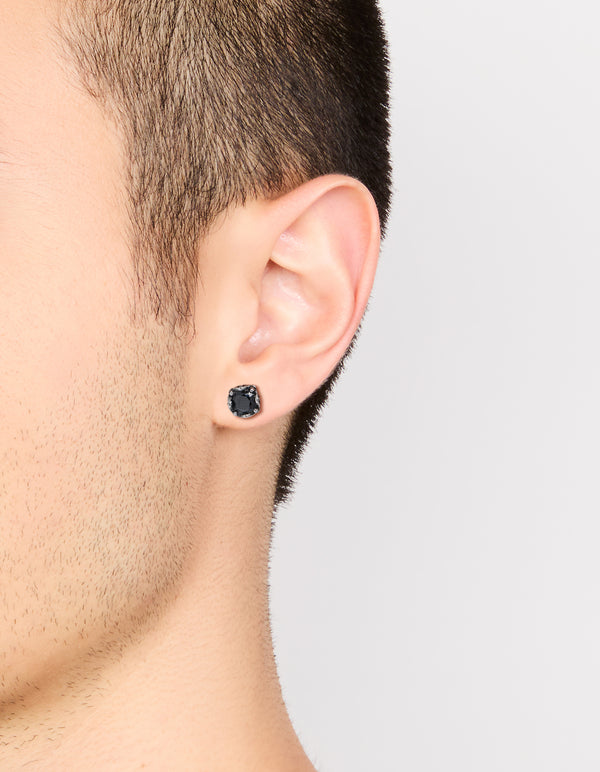 Showcasing waterproof stainless steel mens black cubic zirconia flat back stud earrings in on ear view