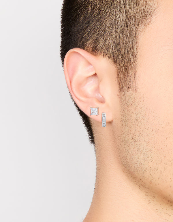 Featuring mens waterproof stainless steel square cubic zirconia and huggie earrings in a 2-pack with crystal accents, hoop closures, and silver tone on ear view